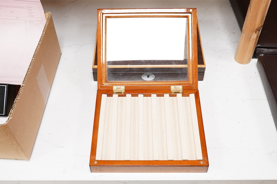 A pair of quality fountain pen desk top cabinets to hold ten and seven pens respectively